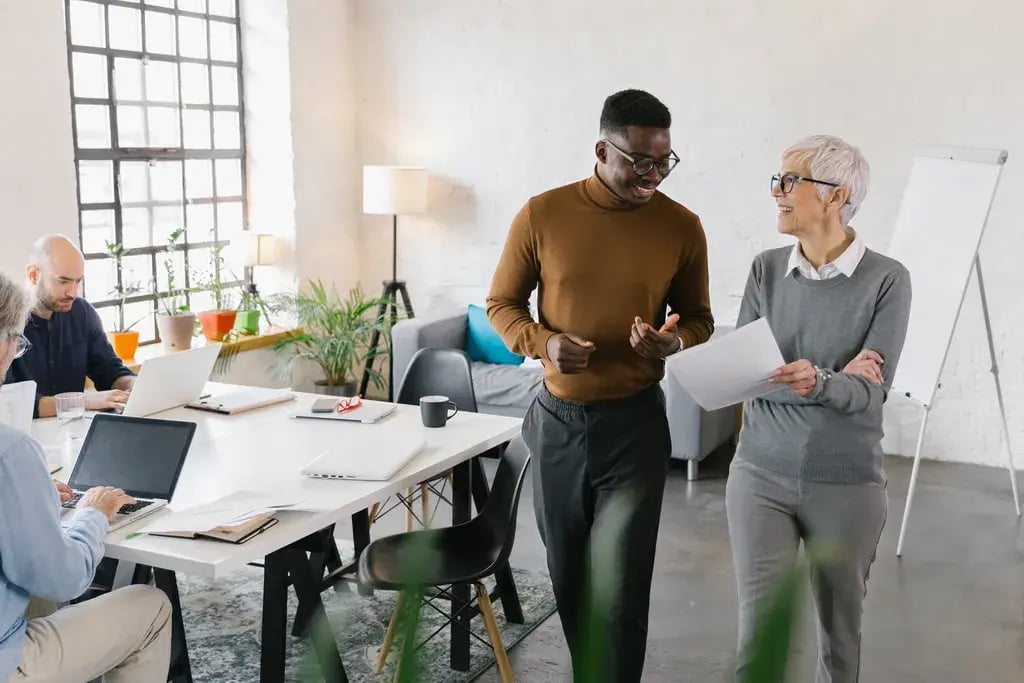 Colleagues talking with documents