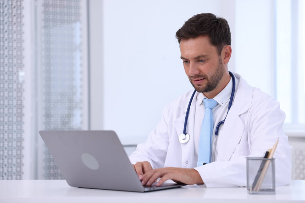 Doctor working on laptop