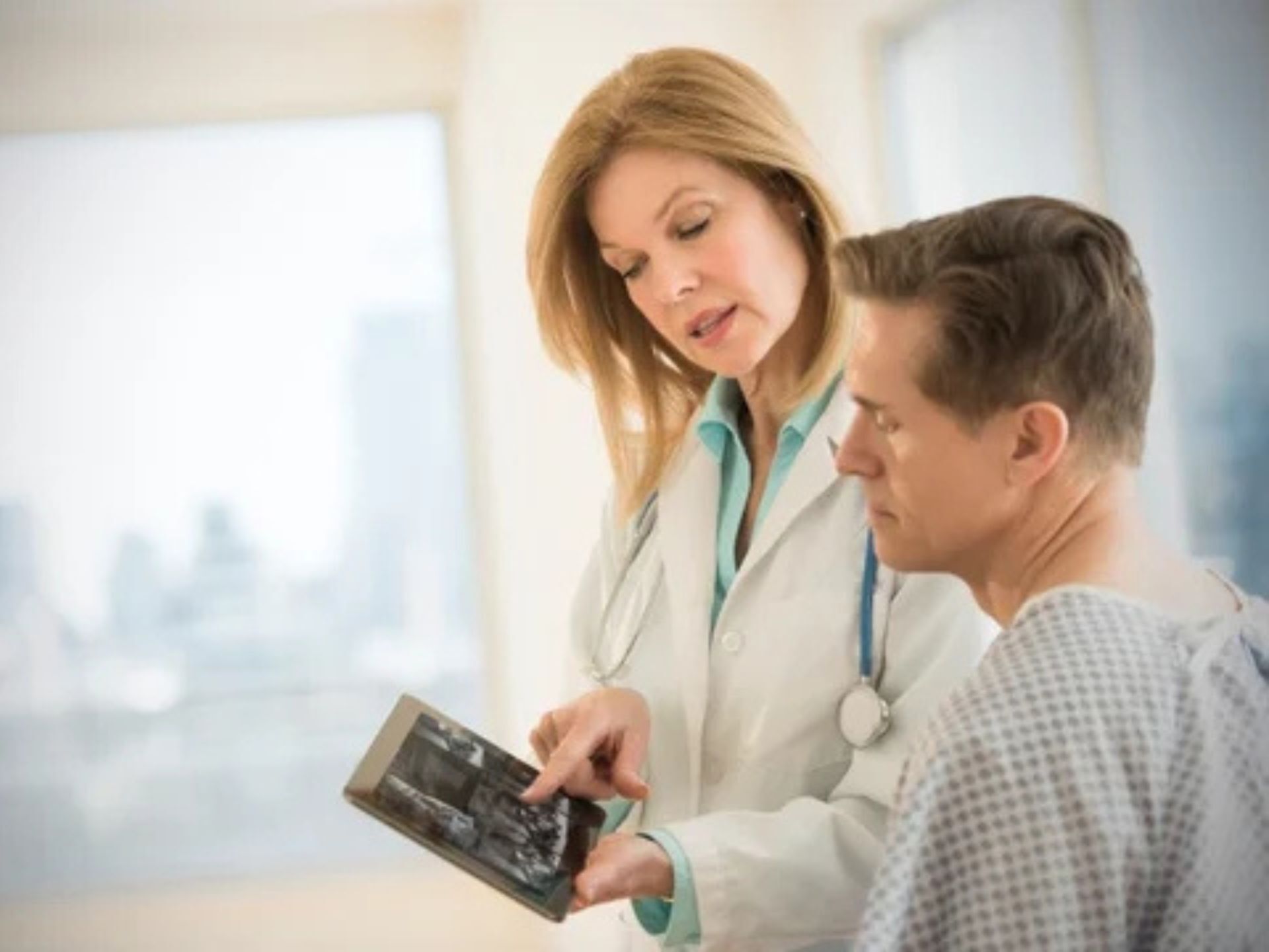 doctor showing patient an app