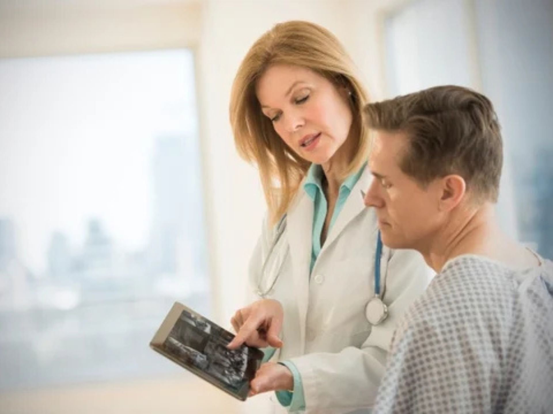 doctor showing patient an app