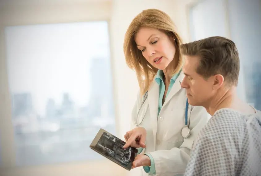 doctor showing patient app