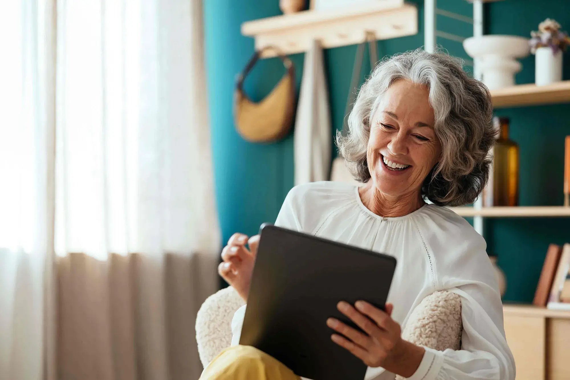 Happy woman using a tablet