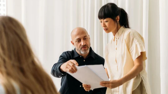 Man and woman looking at documents