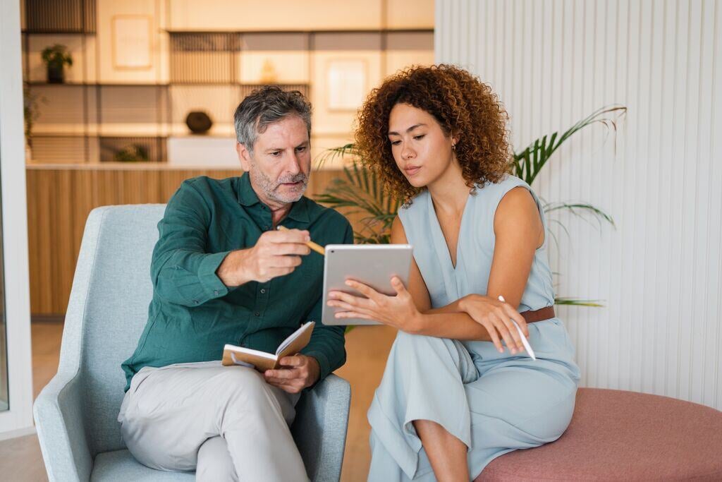 Senior Businessman And Businesswoman Working