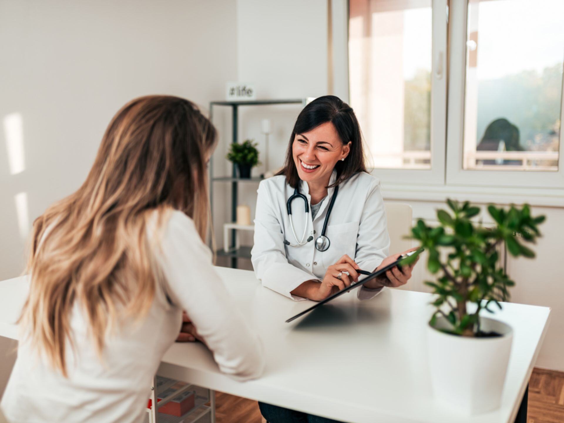 Female specialist explaining diagnosis to her patient