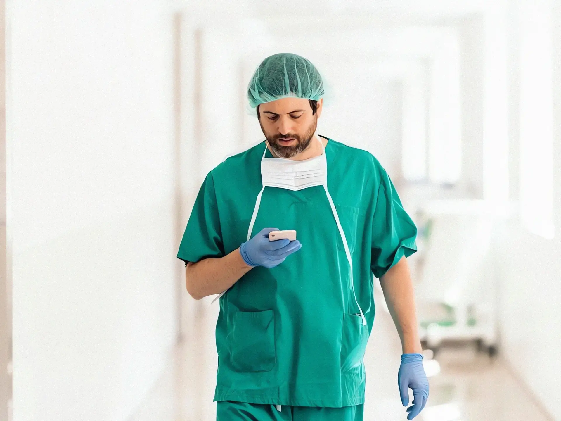 Male doctor holding phone