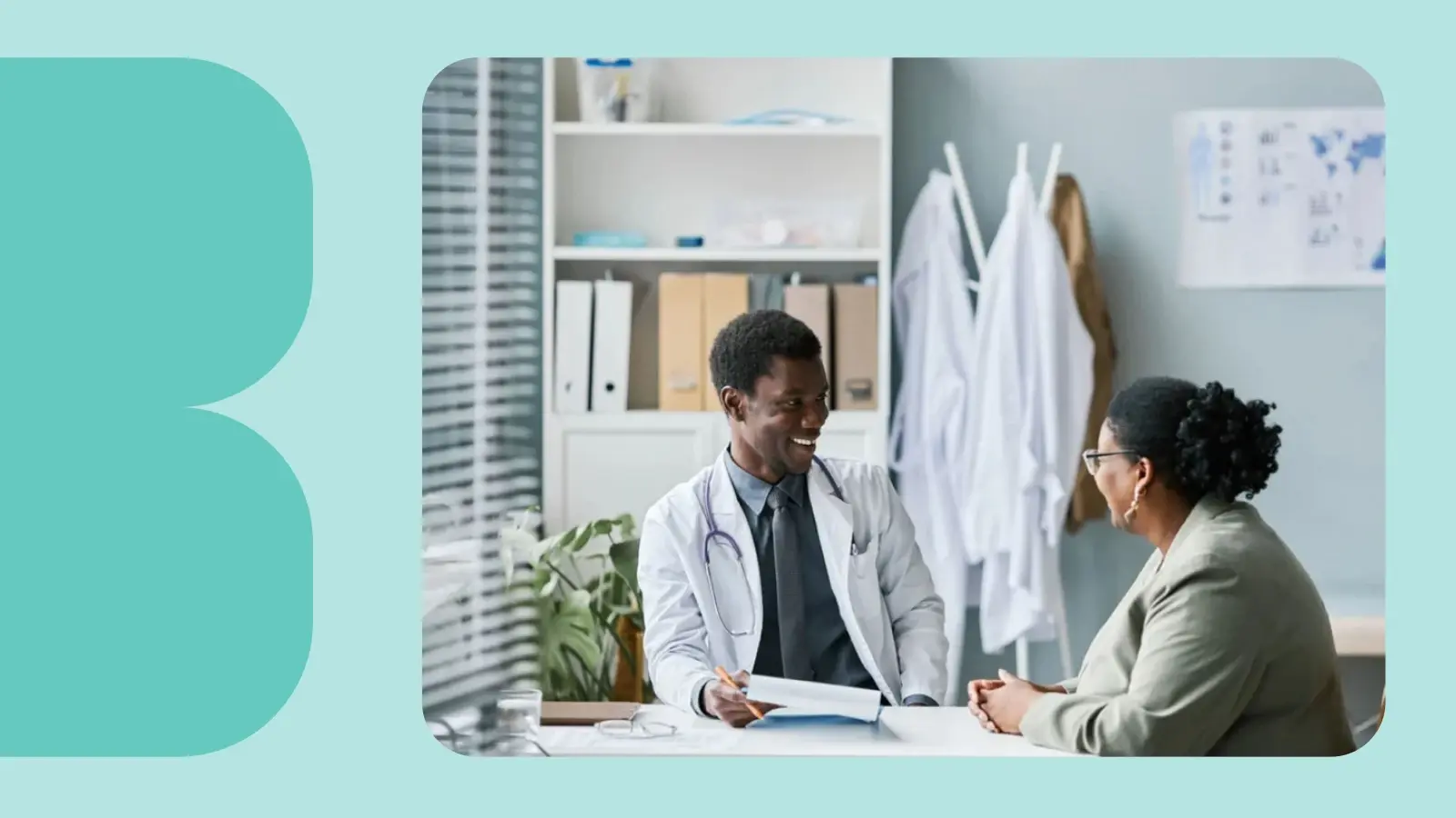 Doctor and patient talking while sitting in an office.